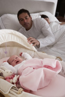 Newborn Baby Crying In Cot In Parents Bedroom